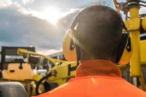 Worker wearing hearing protection equipment